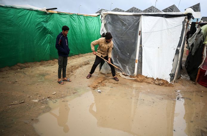 Many tents do not have a ground cover, so many people spent the night on the wet sand.