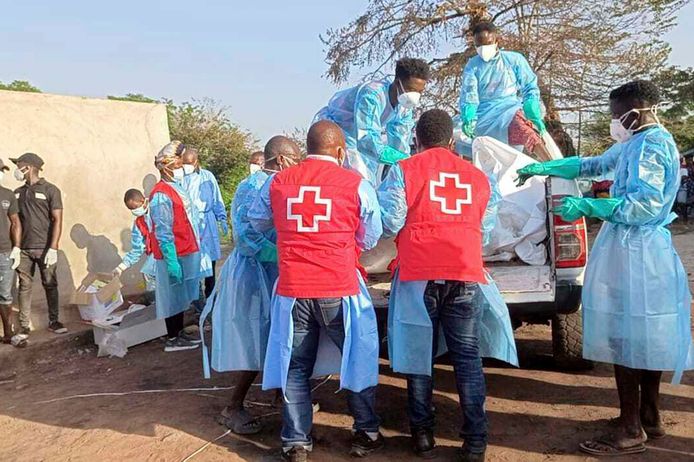 Emergency services recover the bodies of the victims.