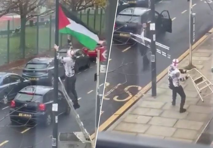 Men attack each other with ladders after a man lowered the Palestinian flag.