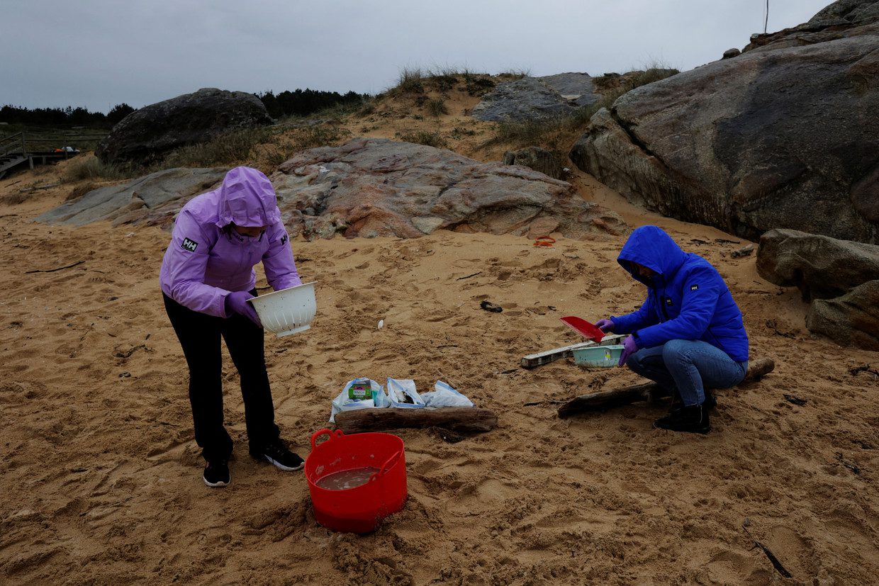 Residents roam the beach of Vilar in Galicia by themselves.  Reuters photo