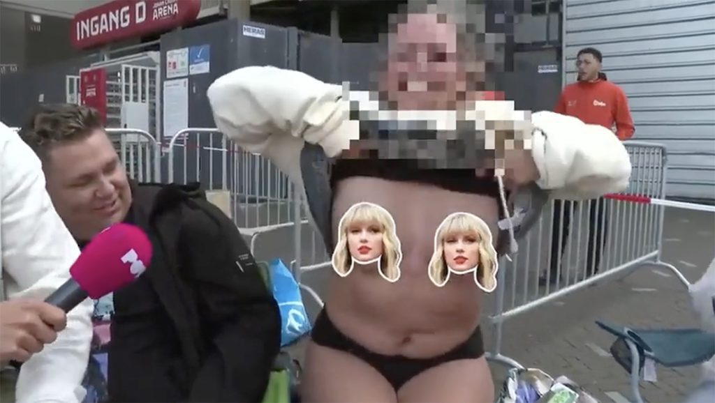 Taylor Swift fan exposes her chest when asked by a reporter (video)